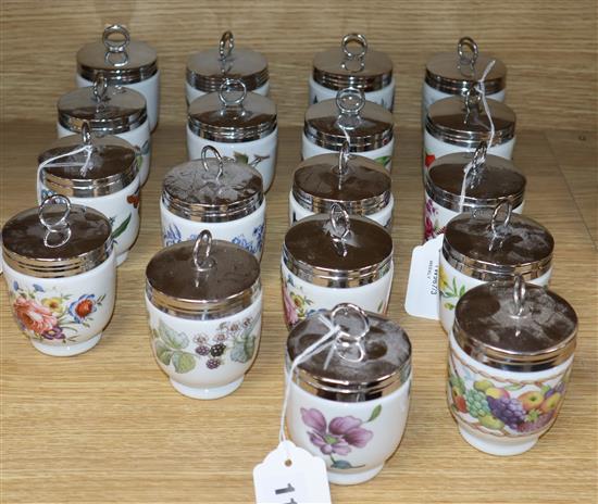 Eighteen Royal Worcester porcelain egg coddlers, including souvenir and commemorative examples